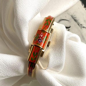 Rare RITMA vintage swiss Gold Plated Women Watch With Gold Leaf Design red Enamel , 17 Jewels mechanical  hand wind watch,peek a Boo watch