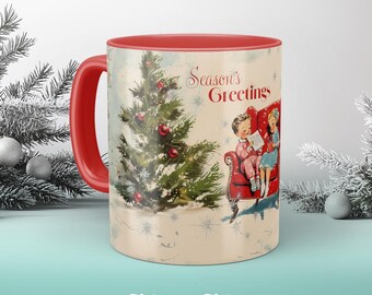 May include: Red and white Christmas mug with a snowy scene of a Christmas tree and two children sitting in a red armchair. The mug reads "Season's Greetings".