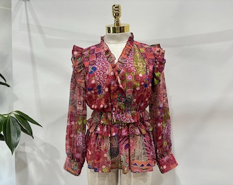 Blusa peplum con volantes y estampado de patchwork vibrante