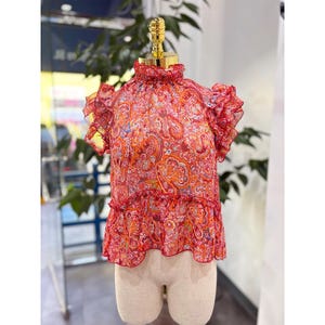 Pink Flutter Sleeve Ruffled Peplum Blouse
