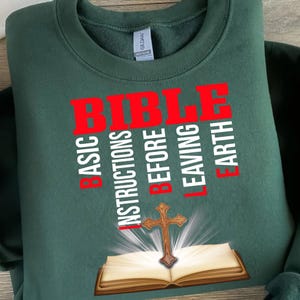 a green shirt with a bible on it