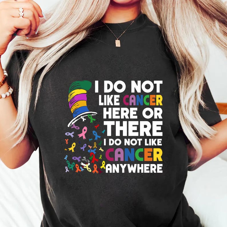 a woman wearing a t - shirt that says i do not like cancer here or
