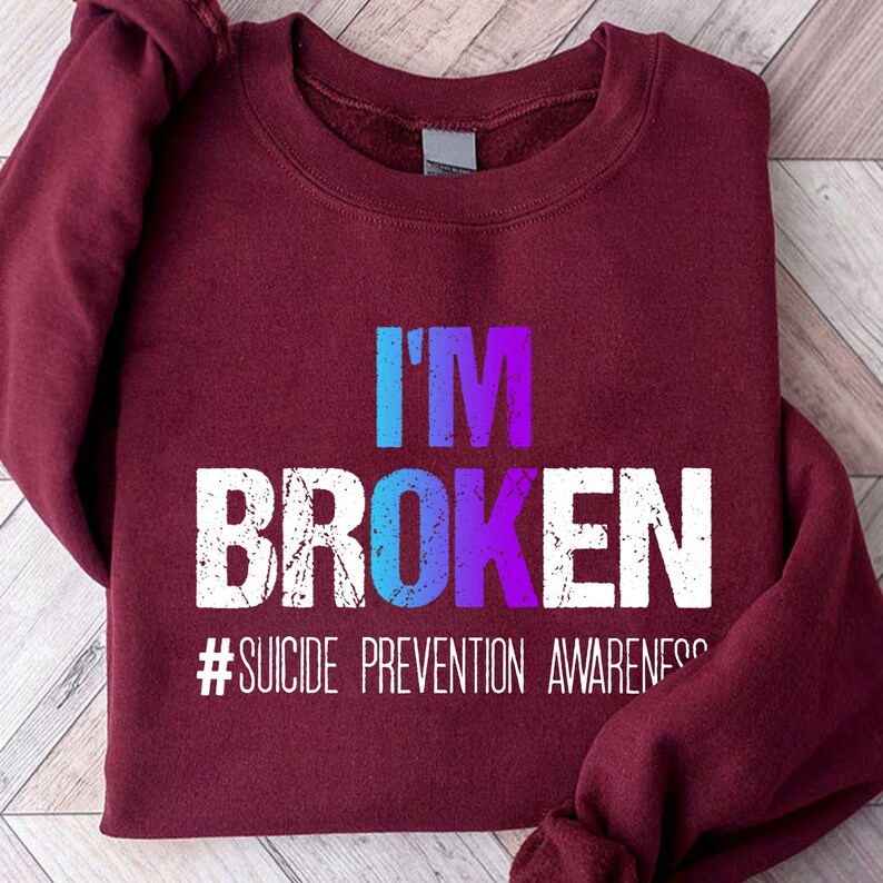 a red sweatshirt with the words i'm broken on it