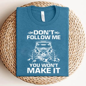a blue t - shirt that says don't follow me you won't