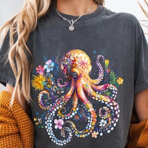 a woman wearing a t - shirt with an octopus on it