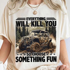 a woman wearing a white t - shirt that says, everything will kill you so