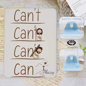 Peut inclure: Une coque de tablette blanche avec les mots "Can't, Can't, Can, Can" en script marron, accompagnés d'illustrations de Jésus. Le nom "Mary" est écrit en dessous. Un support de tablette bleu est également montré.
