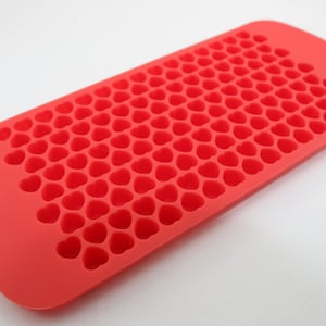 May include: Red silicone ice cube tray with heart-shaped moulds.