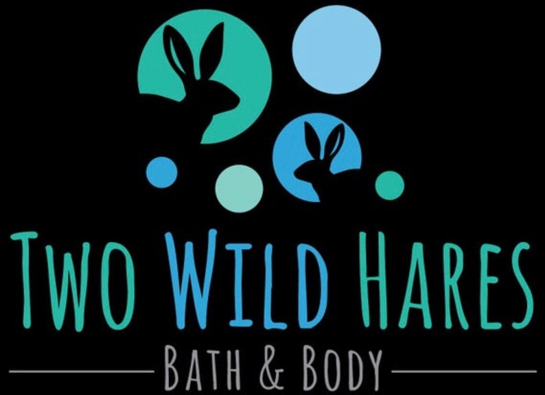 May include: Logo for Two Wild Hares Bath & Body, featuring two stylized silhouettes of hares in blue circles on a black background. The text is in green and blue.