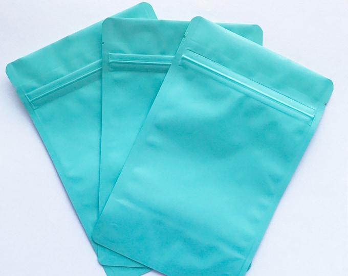 100-6x9 MATTE TURQUOISE Stand Up Pouches, Heavy Duty 5.4mil, Tear Notch, Impulse + Zipper Seal, Two Wild Hares