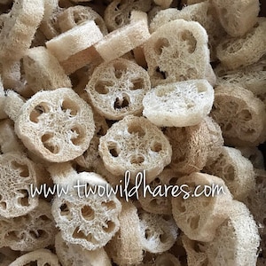 May include: A close-up image of a pile of natural loofah sponges. The loofah sponges are light brown in color and have a rough, textured surface. The loofah sponges are in various shapes and sizes. The loofah sponges are a natural product and are used for bathing and exfoliating.