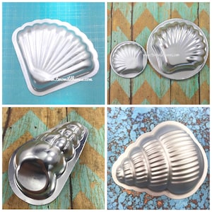 May include: Four silver metal molds shaped like seashells. The molds are for making chocolate or other treats. The molds are on a variety of backgrounds, including blue, green, and brown.