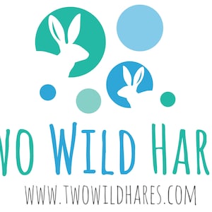May include: A logo for a business called "Two Wild Hares" with the text "www.twowildhares.com" below. The logo features two white rabbits in blue and green circles, with additional blue and green circles scattered around.