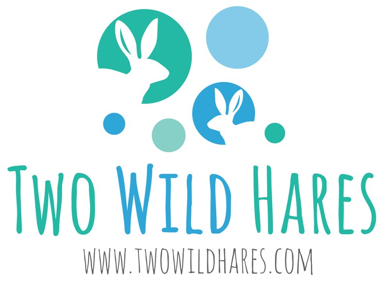 May include: A logo for a business called "Two Wild Hares" with the text "www.twowildhares.com" below. The logo features two white rabbits in blue and green circles, with additional blue and green circles scattered around.