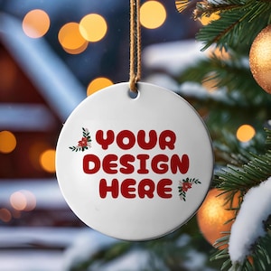 May include: White ceramic Christmas ornament with red floral accents and the text "YOUR DESIGN HERE" in red.