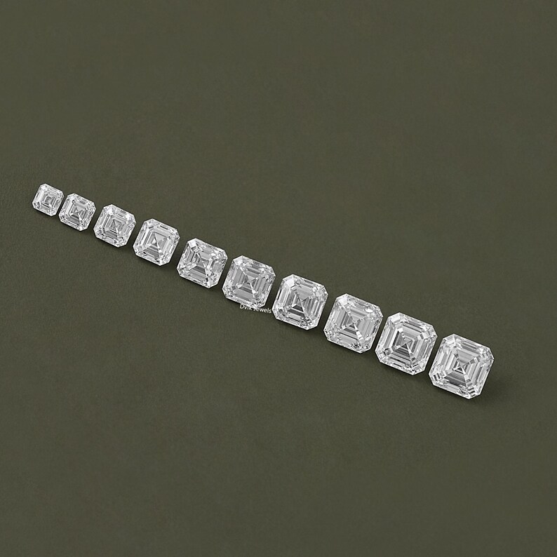 May include: A row of ten clear, square-shaped, princess cut diamonds of varying sizes, arranged from smallest to largest on a green background.