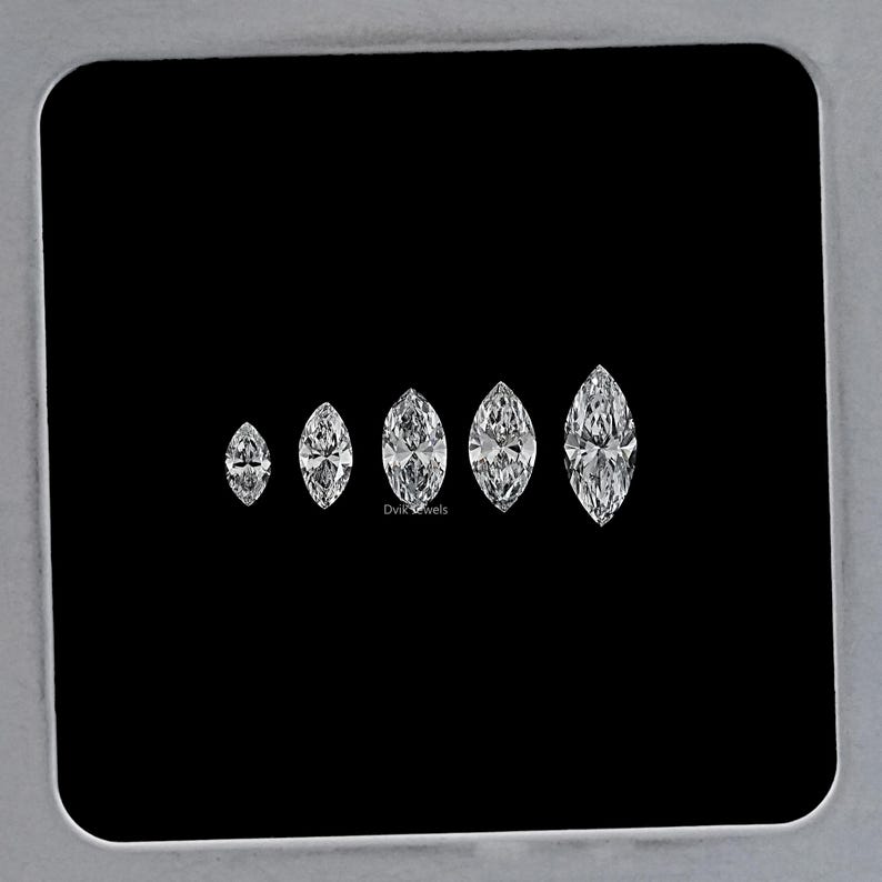 May include: A set of six marquise-shaped diamonds of varying sizes, displayed on a black background. The diamonds are clear and brilliant, with a slight sparkle.