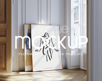 May include: A framed art print mockup featuring a black and white line drawing of a figure. The frame is gold-colored, and the artwork is leaning against a wall in a room with a wooden floor. The text "FRAME MOCKUP" is overlaid on the image.