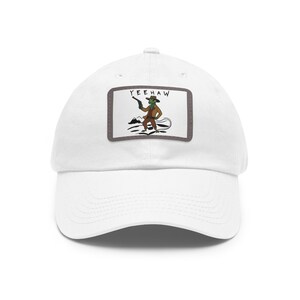 May include: White baseball cap with a patch featuring a cartoon cowboy with a gun and the text "YEEHAW".