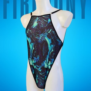 May include: A one-piece swimsuit with a high-cut leg and halter neck design. The fabric features a swirling pattern in shades of blue, teal, and purple against a black background. The swimsuit is displayed on a white mannequin against a blue backdrop.