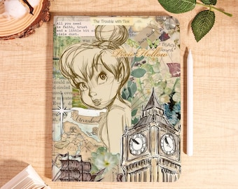 May include: A notebook featuring a sketch of Tinkerbell with the words "Pixie Hollow" and "Neverland". The design includes a map, Big Ben, and floral accents. A white stylus rests on the wooden surface.