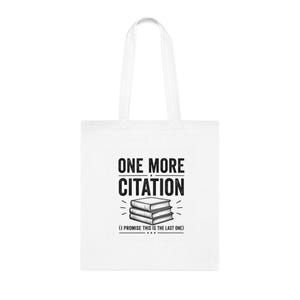 May include: A white tote bag featuring a black graphic of a stack of three books. Above the books, the text reads ONE MORE CITATION in a bold, sans-serif font. Below the books, the text reads (I PROMISE THIS IS THE LAST ONE) in parentheses.