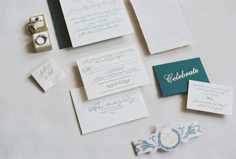 luxury foil and letterpress calligraphy wedding invitations with monogram, watercolor belly band, and handmade paper