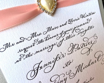 Hand Calligraphy Wedding Invitation on metallic paper with ribbon and brooch printed in letterpress by Robyn Love