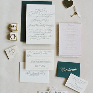 luxury foil and letterpress calligraphy wedding invitations with monogram, watercolor belly band, and handmade paper