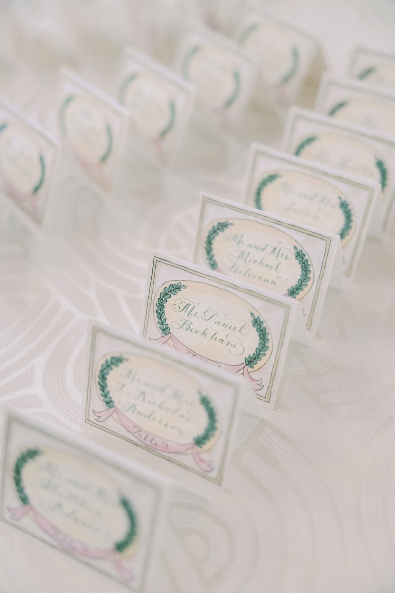 luxury calligraphy wedding escort cards with watercolor painting