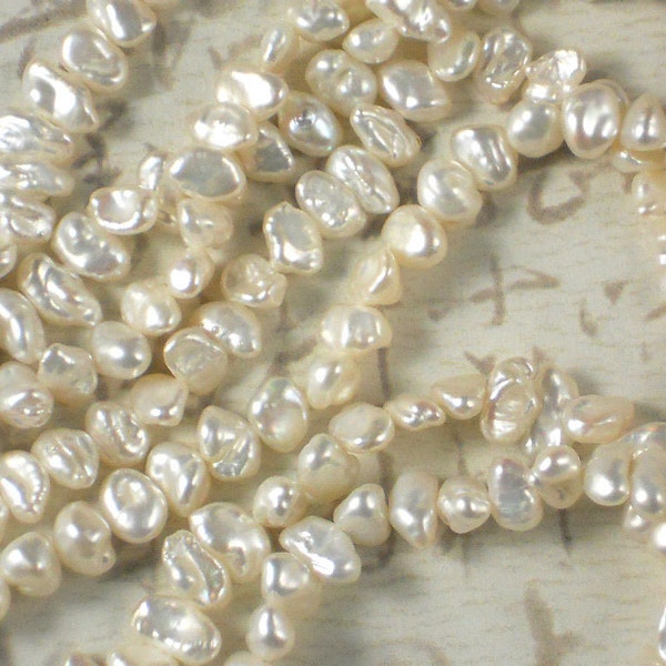 Keishi Pearls Bridal Creamy White Oval Side Drilled Hong Kong - Full Strand  (4135)