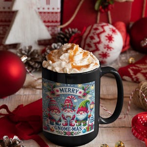 May include: A black ceramic mug filled with a whipped cream and caramel drink. The mug features a festive design with the words "MERRY GNOME-MAS" and illustrations of gnomes. The background includes Christmas decorations.