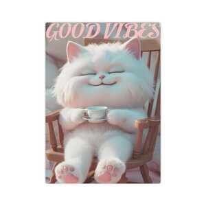 May include: A whimsical illustration of a fluffy white cat with pink ears and paws, seated in a wooden rocking chair. The cat holds a teacup and saucer, with the text "GOOD VIBES" in pink above. The cat has its eyes closed and is smiling.