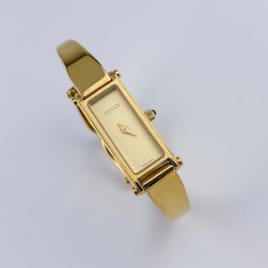 Gucci vintage gouden horloge champagne wijzerplaat