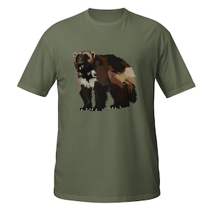 May include: An olive green short-sleeved t-shirt featuring a graphic illustration of a wolverine on the front. The wolverine is depicted with dark brown, black, and tan fur, standing in a profile position with its head turned towards the viewer.