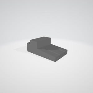 May include: A gray, geometric 3D model of a stepped platform. The platform has a rectangular base with three parallel grooves and a raised, stepped section on one end. The object is rendered with soft shadows against a white background.