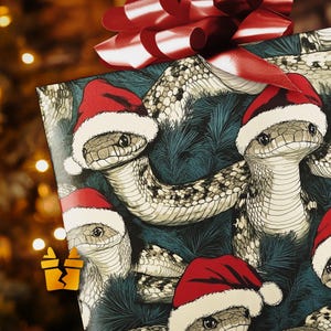 May include: Christmas wrapping paper featuring a pattern of snakes wearing Santa hats on a dark blue background.