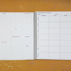 a planner with a pen on top of it