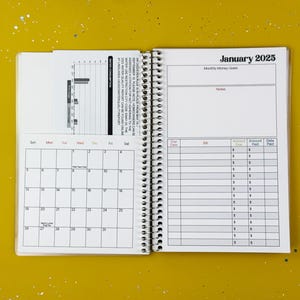 a calendar is open on a yellow surface