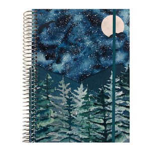 May include: A spiral-bound notebook featuring a watercolor-style cover illustration of a dark blue starry night sky with a full moon and silhouettes of birds above a forest of green pine trees and dark mountain peaks, secured by a teal elastic band.