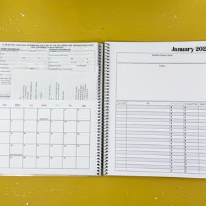 a calendar is open on a yellow surface