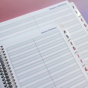 a spiral-bound notebook with a page dedicated to January birthdays, with a separate page for January birthdays and a separate page for January birthdays. The notebook is open and appears to be in use, with the page for January birthdays visible.