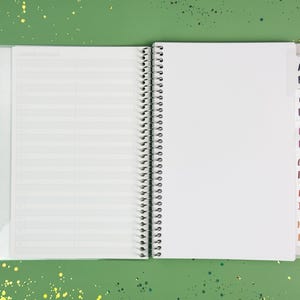 a notebook with a pen on top of it