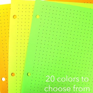 May include: A stack of three sheets of paper in shades of yellow and green, each with a dotted pattern and three holes for binding. The text "20 colors to choose from" is visible on the bottom right.