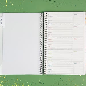 a note book with a pen on top of it
