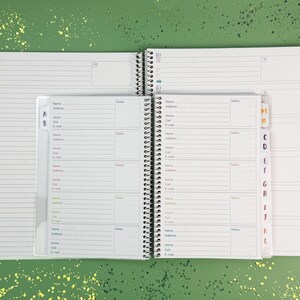 a planner with a pen on top of it