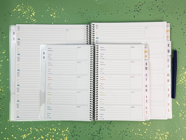 a planner with a pen on top of it