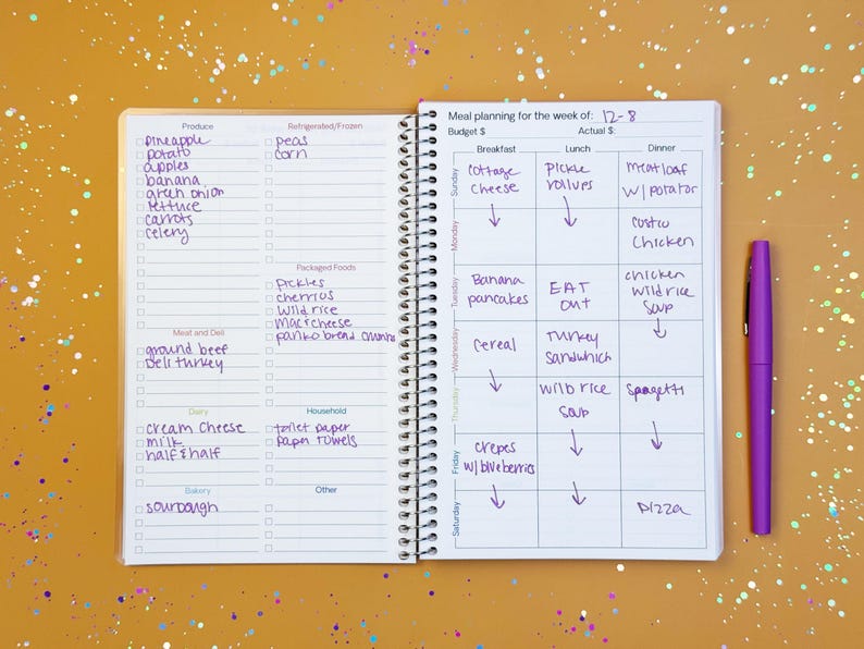a notebook with a list of things to do on it