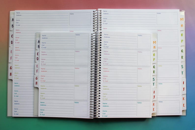 an open spiral-bound notebook with multiple pages, each containing a form for recording contact information. The notebook has a colorful and organized layout, with each page divided into sections for different types of information, such as names, addresses, and phone numbers. The overall appearance of the notebook suggests it is designed for use in a professional or personal context, where the ability to organize and retrieve contact information is essential.