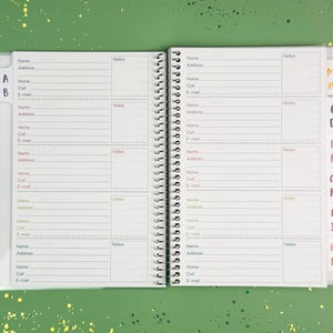 a planner with a pen on top of it